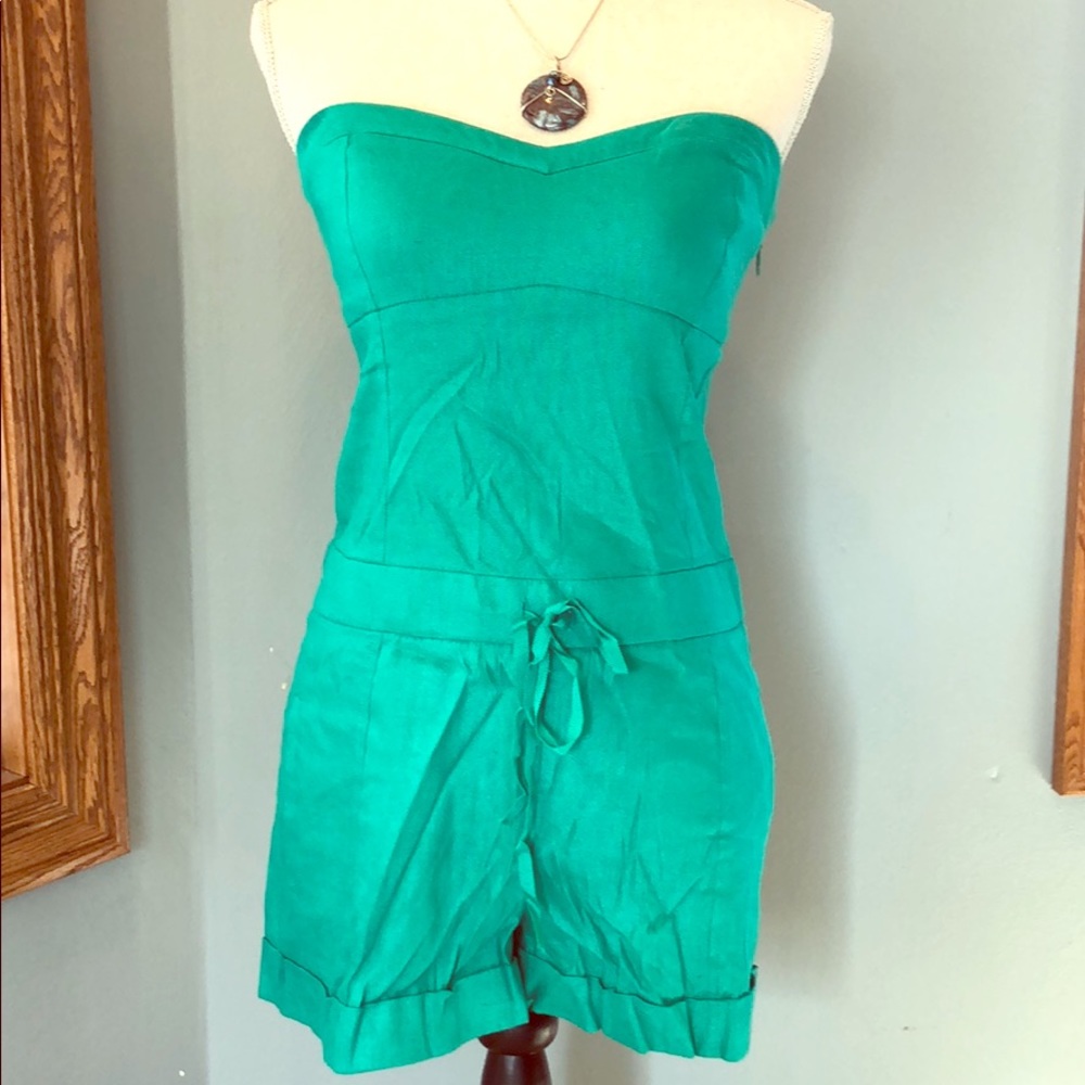Bebe green strapless romper.